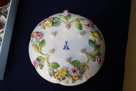 A Meissen flower encrusted cup and saucer